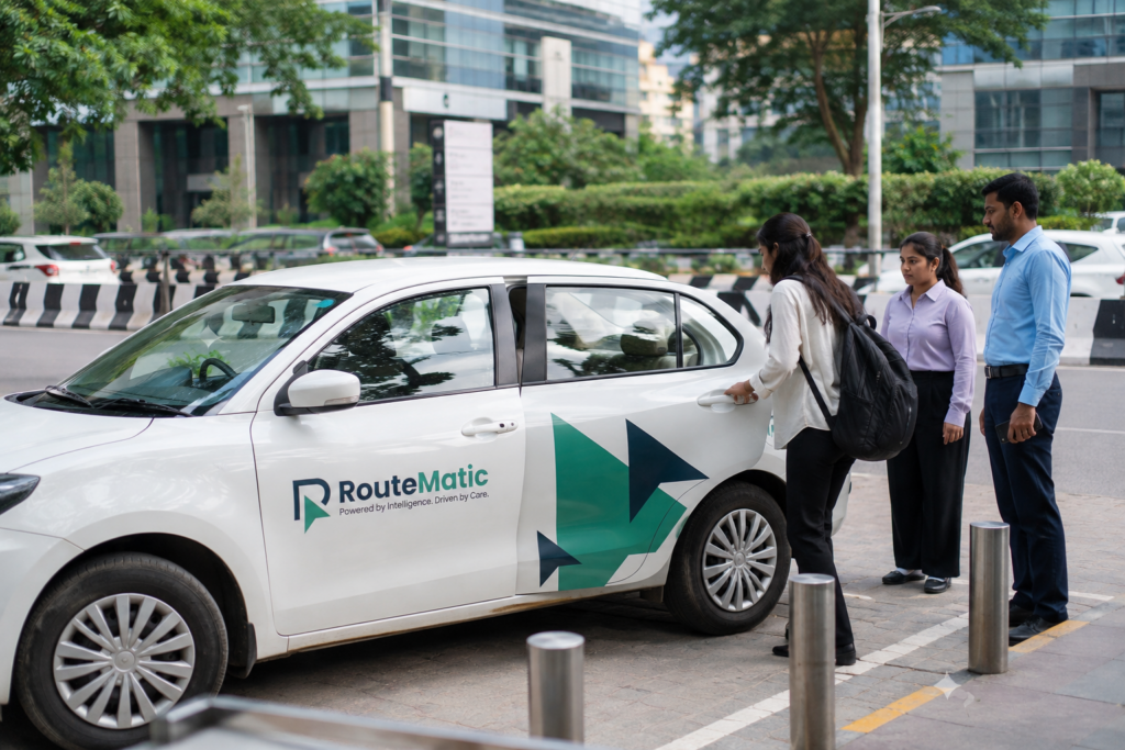 RouteMatic employee transport car with corporate employees outside an office